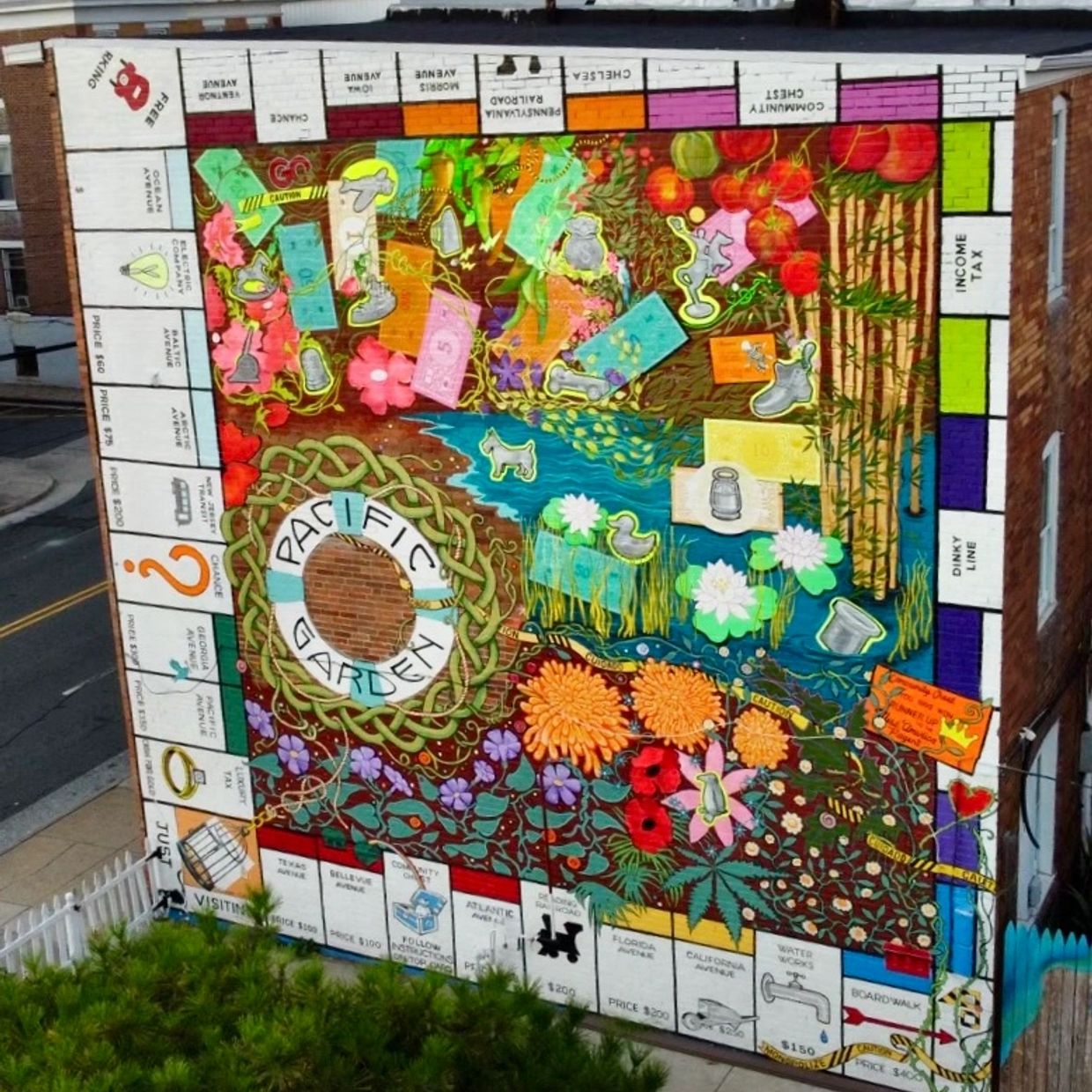 Colorful Pacific Garden mural on building wall.