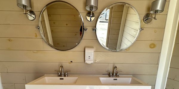 portable bathrooms , restrooms, luxury mirrors, double sinks, vanity, ports potty, outside bathroom