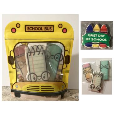 School bus-themed cookie set with crayons and notebook characters.