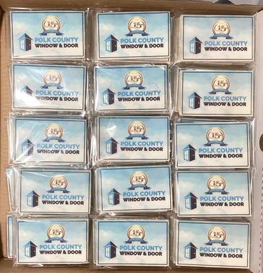 Multiple Polk County Window &amp; Door logo stickers arranged in a grid.