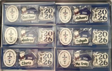 Personalized graduation keychains for the Class of 2026 with names and caps.