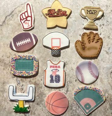 Sports-themed cookies with various designs.