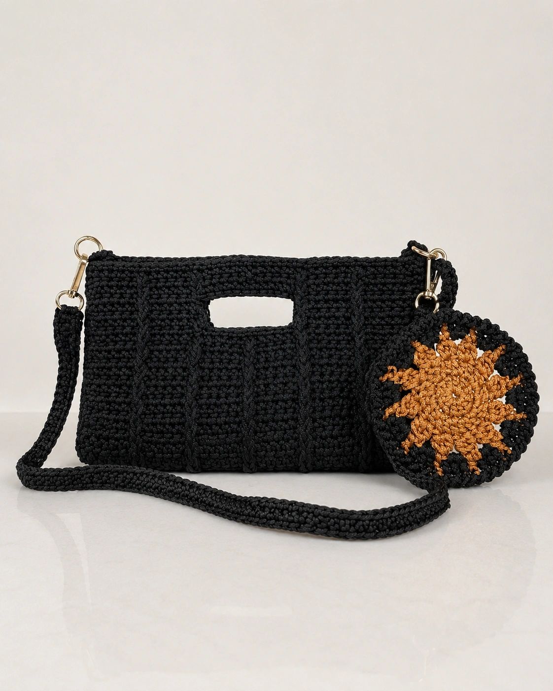 A richly textured black evening crochet handbag. Designed for sophistication and quiet luxury, perfe