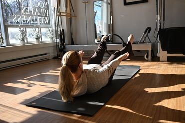 A woman practicing The Hundred with a magic circle
