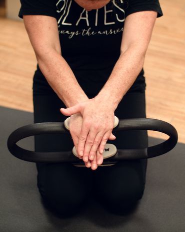 A woman pressing down onto a magic circle