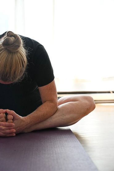 A woman in a butterfly pose