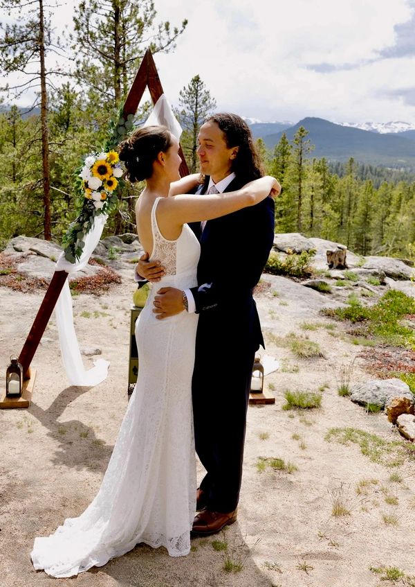 mountain wedding ceremony site with panoramic views & wedding arch