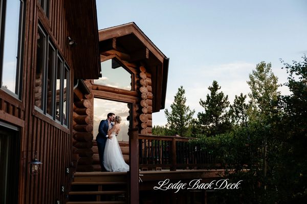 mountain elopement photo on the back deck of Blue Sky Mountain Ranch