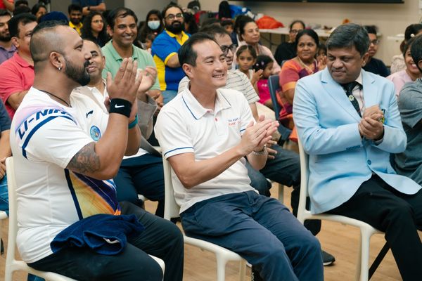 People clapping and enjoying an event.
