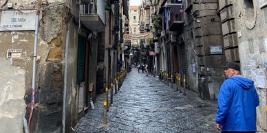 Narrow cobblestone street in a historic city.