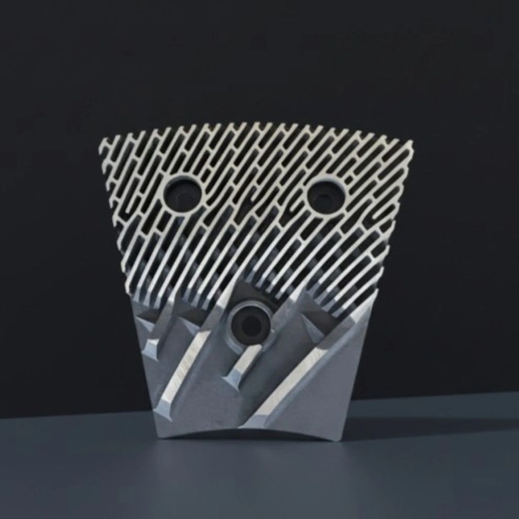 refiner plate with geometric patterns and three circular holes.