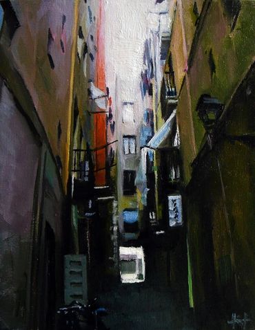 Narrow Barcelona backstreet with laundry hanging from balconies