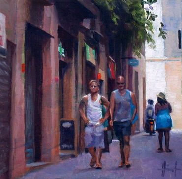 Two young men walking through alley in Barcelona