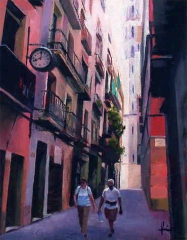 A couple walking along an alleway in Barcelona