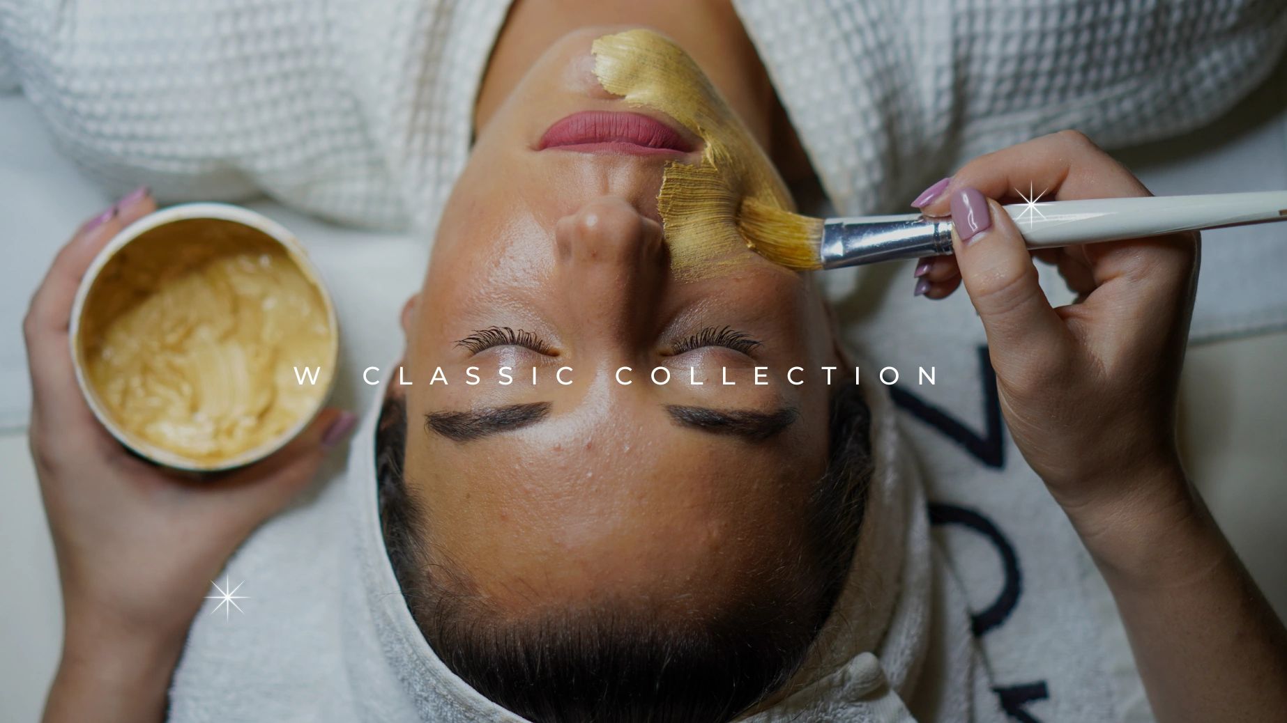 Facial spa treatment with golden mask application.