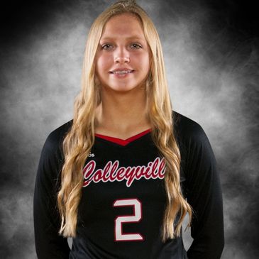 Young female volleyball player in black jersey.