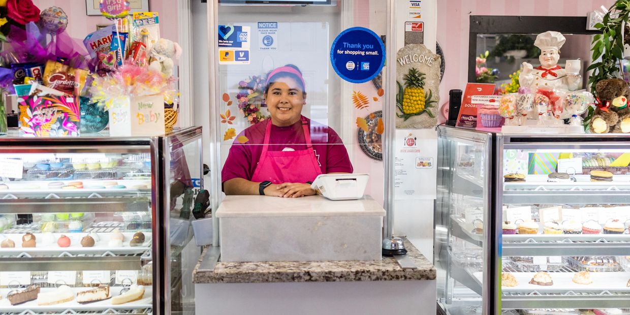 One of Sarah's Sweets & Flower Shoppe's smiling employees waiting to greet you and take your order.