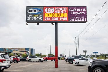 Sarah's Sweets & Flower Shopper business sign. 