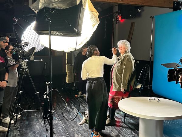 An ASL user getting her make-up touched up on set of the Menstrual Matters video series