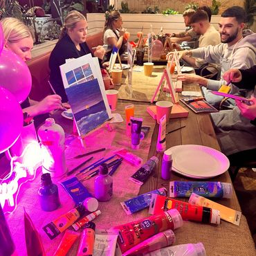 Friends enjoying a sip and paint night at Revolución de Cuba with Paint & Pompom in Cardiff