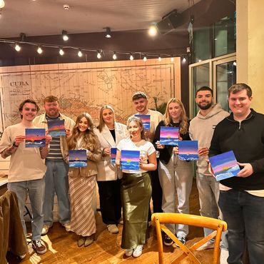Friends enjoying a sip and paint night at Revolución de Cuba with Paint & Pompom in Cardiff