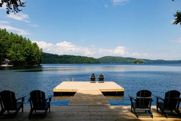 Lakeside deck and dock overlooking the sprawling view of Redstone Lake in Haliburton Ontario.