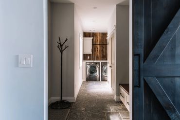 A spacious laundry and mudroom area help keep clutter out of site.