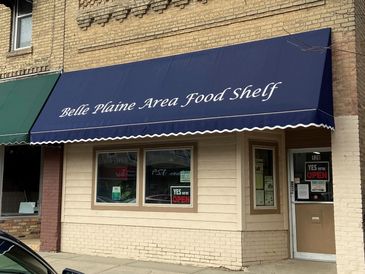 Belle Plaine Area Food Shelf storefront with blue awning.
