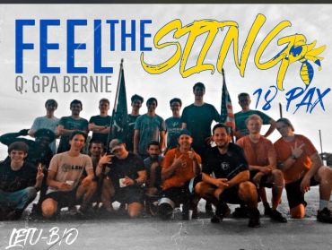 Group photo of 18 people with flags and bold text saying 'Feel the Sting'.