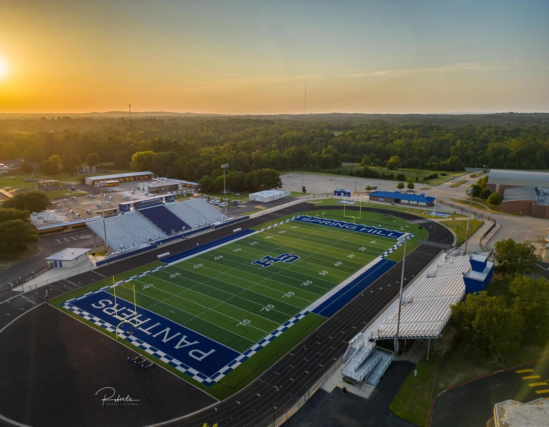 Aerial view of Spring Hill Panthers football stadium at sunset.