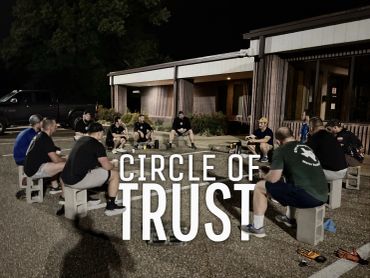 A group sitting in a circle outdoors at night, captioned 'Circle of Trust'.