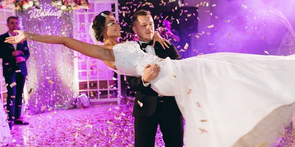 Wedding Couple showing off a lift at their first dance