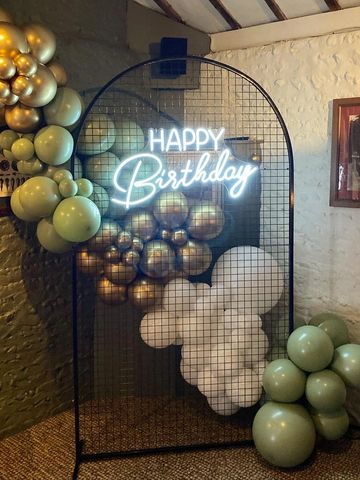 Black mesh frame, neon happy birthday with balloons to hire
