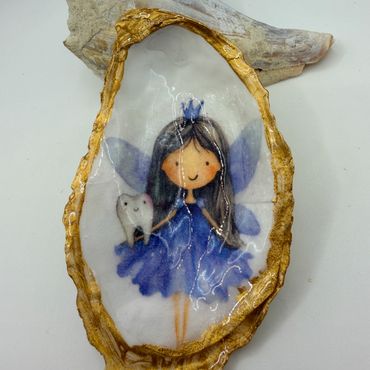 Hand-painted fairy with tooth on an oyster shell.