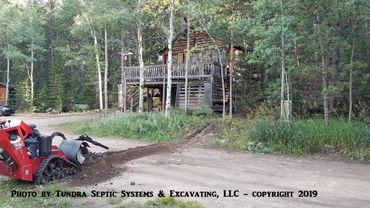 Trenching for electric line for septic pump system in Boulder County