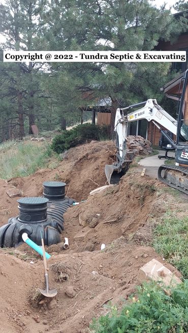 Excavating for a new septic tank in Boulder