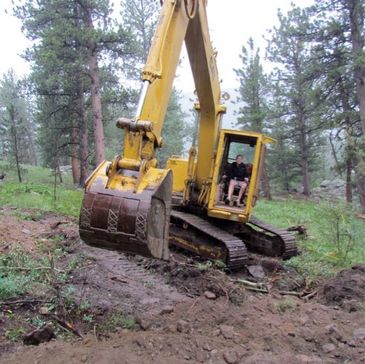Woman owned septic business in Boulder and Larimer County. She operates her own heavy equipment.
