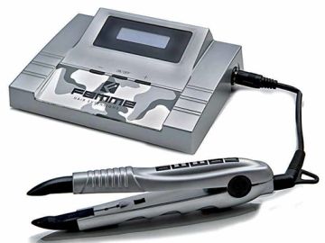 A silver hair straightener with a digital control unit.