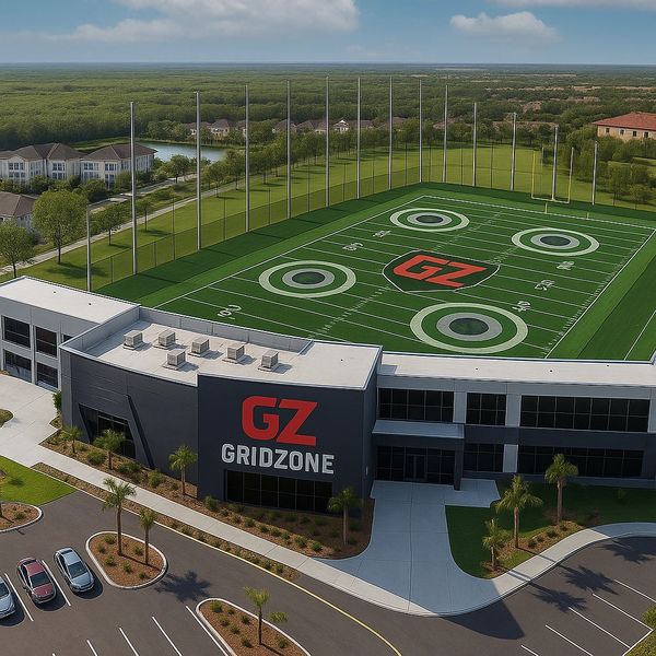 Aerial view of Gridzone facility with a football practice field on the roof.