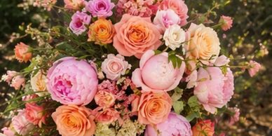 Beautiful bouquet of pink and peach roses and peonies.