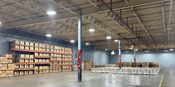 Large warehouse with stacked boxes and pallets.