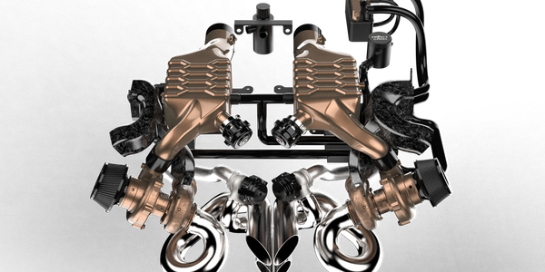 High-performance twin-turbo engine setup with polished exhaust headers.