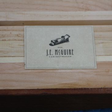 J.E. McGuire Cabinetry logo