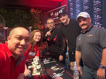 Monk, the AAG Team, and Aliaksei Protas at the May signing.