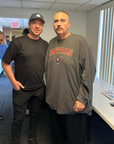 Nicklas Bäckström and Monk at the 2024 Toys for Tots event.