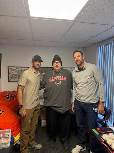 Toys for Tots Drive 2025. Monk and Orioles Jim Johnson and Nick Markakis.