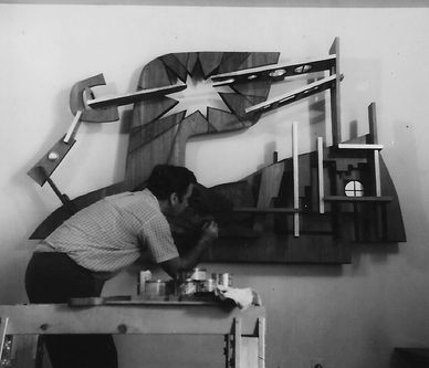 Man painting a modern abstract wall art.