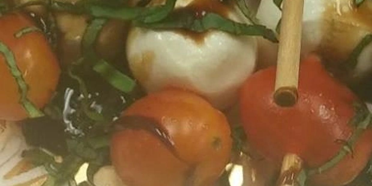 Mozzarella, Tomato, Fresh Basil, topped with Balsamic Glaze Skewered
