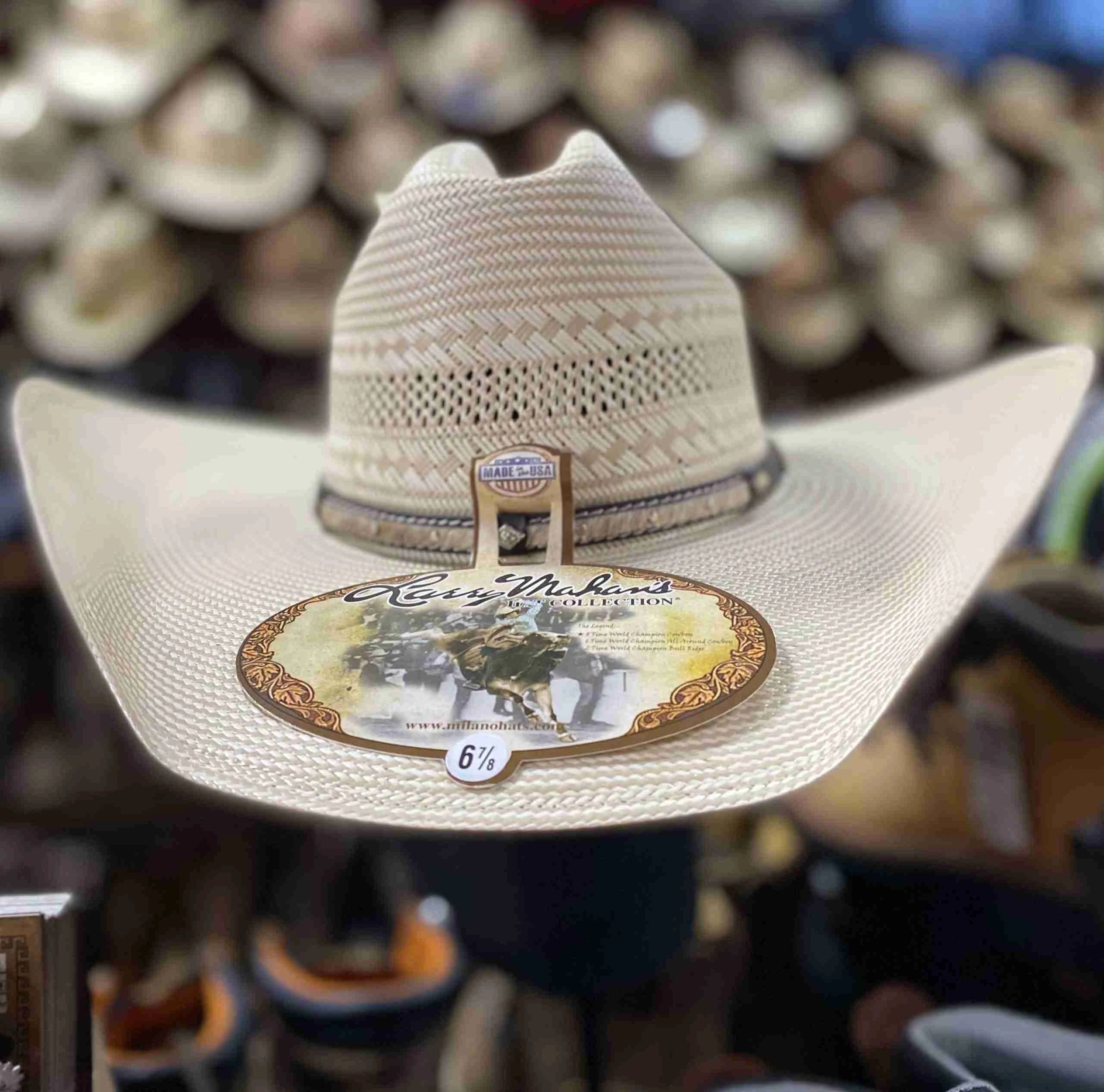 Close-up of a Larry Mahan straw cowboy hat with a "Made in USA" tag.
