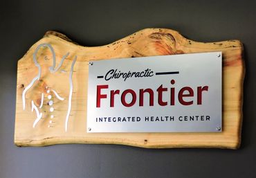 Chiropractor sign with live edge wood slab